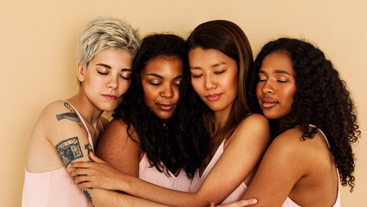 four women hugging each other